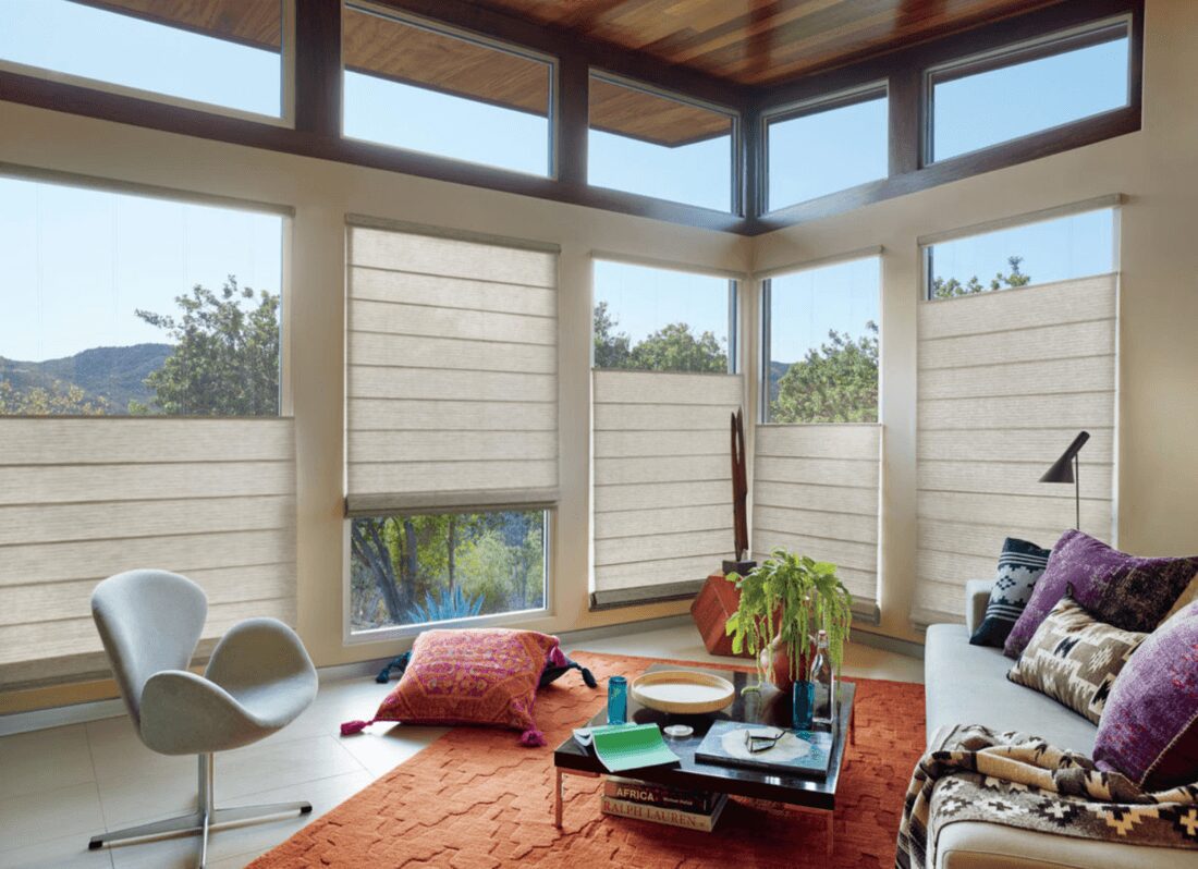 choosing-hunter-douglas-custom-shades-for-homes A living room with many windows and furniture