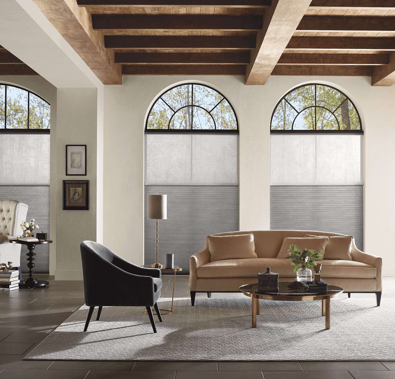 A living room with three windows and a couch