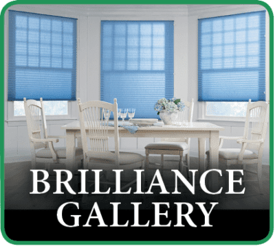 A dining room with chairs and tables in front of windows.