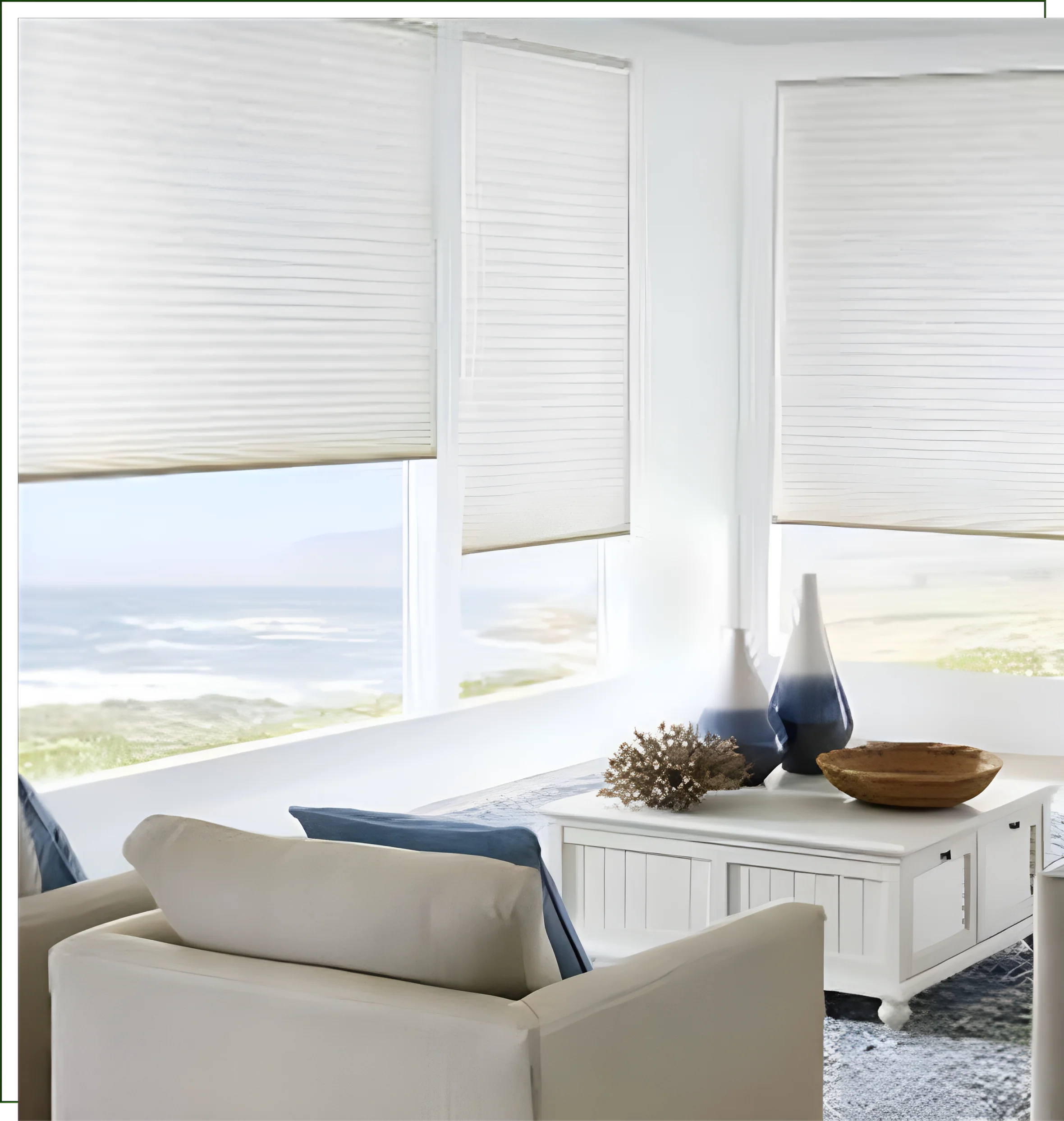A living room with white furniture and windows.
