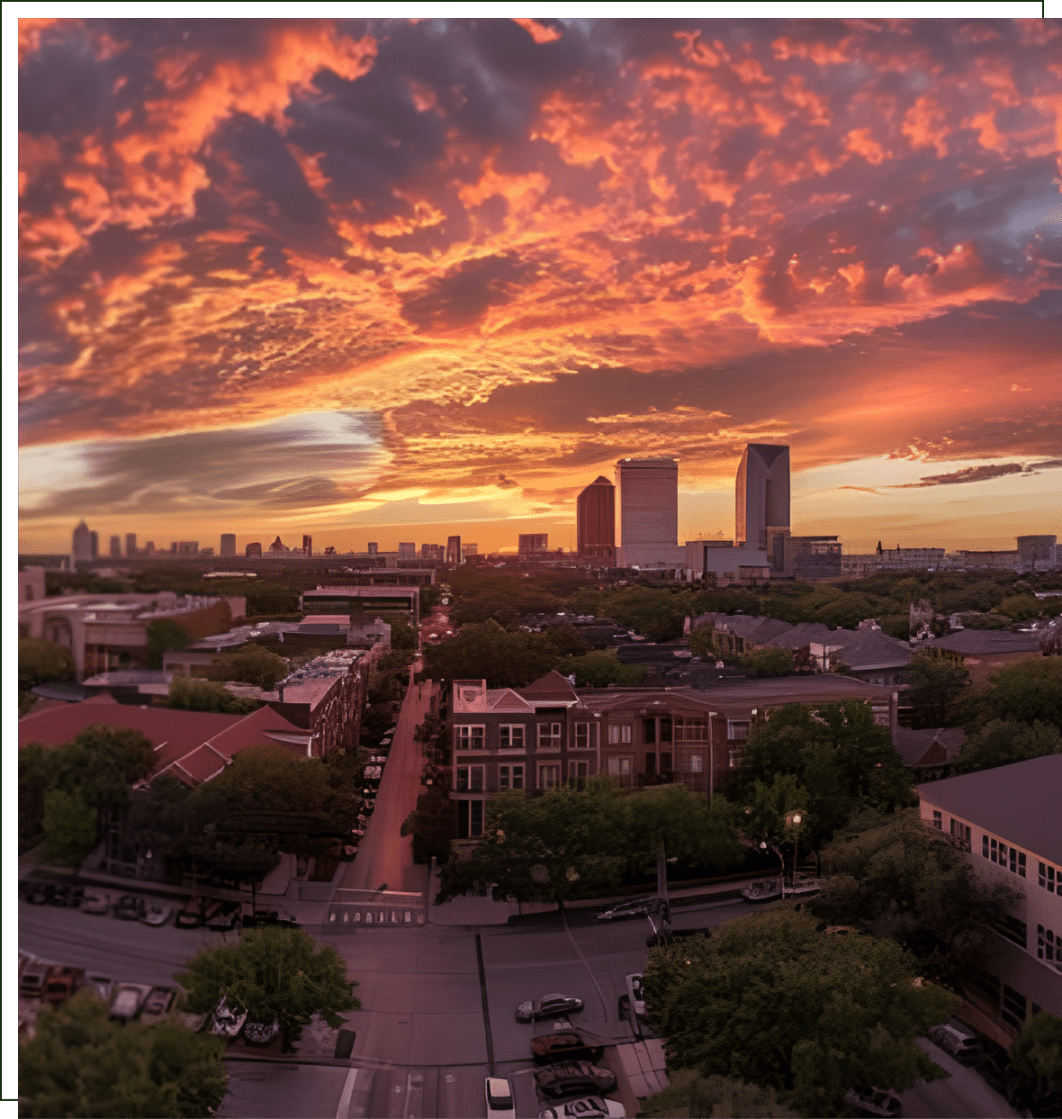 A view of the city skyline at sunset.