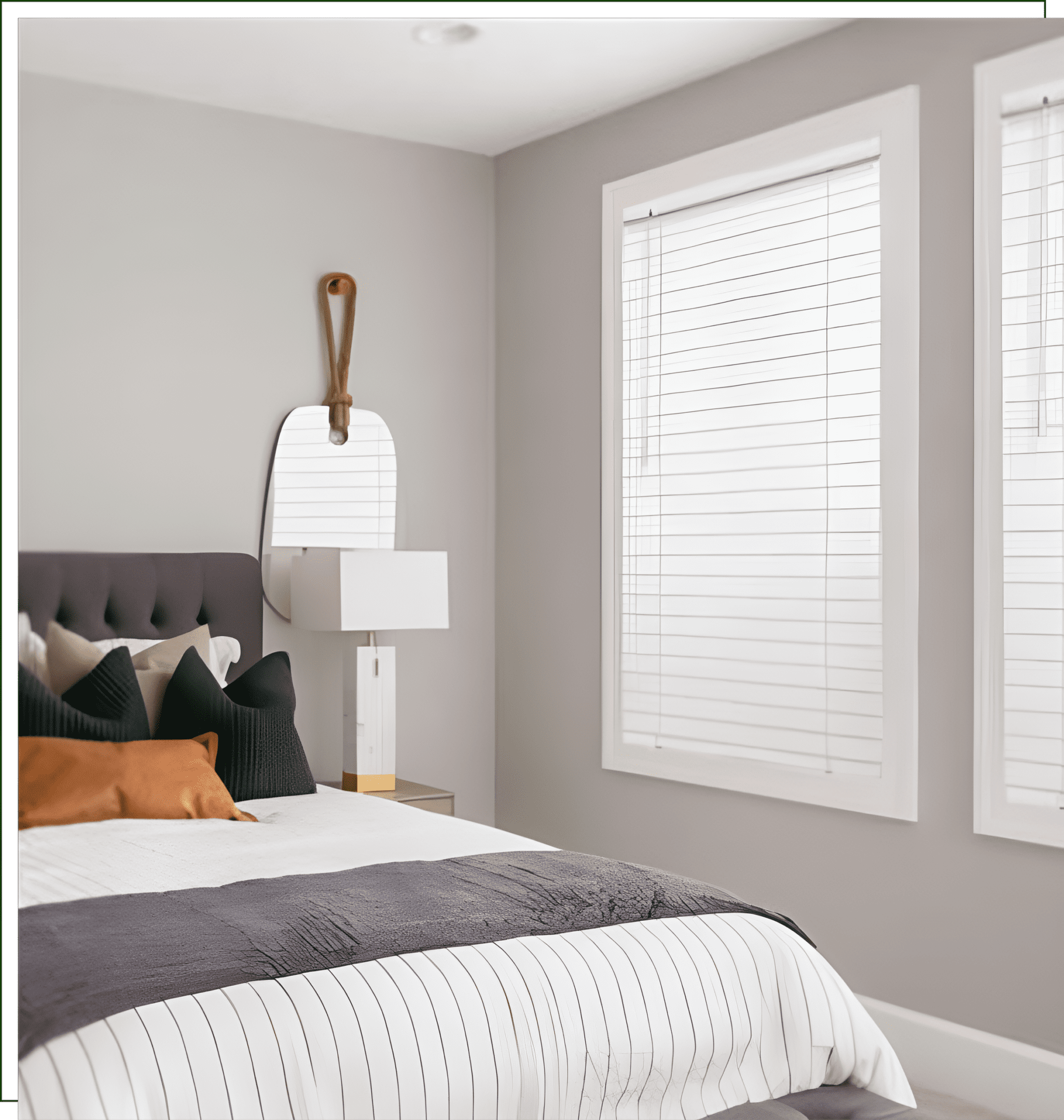 A bedroom with white walls and a bed.