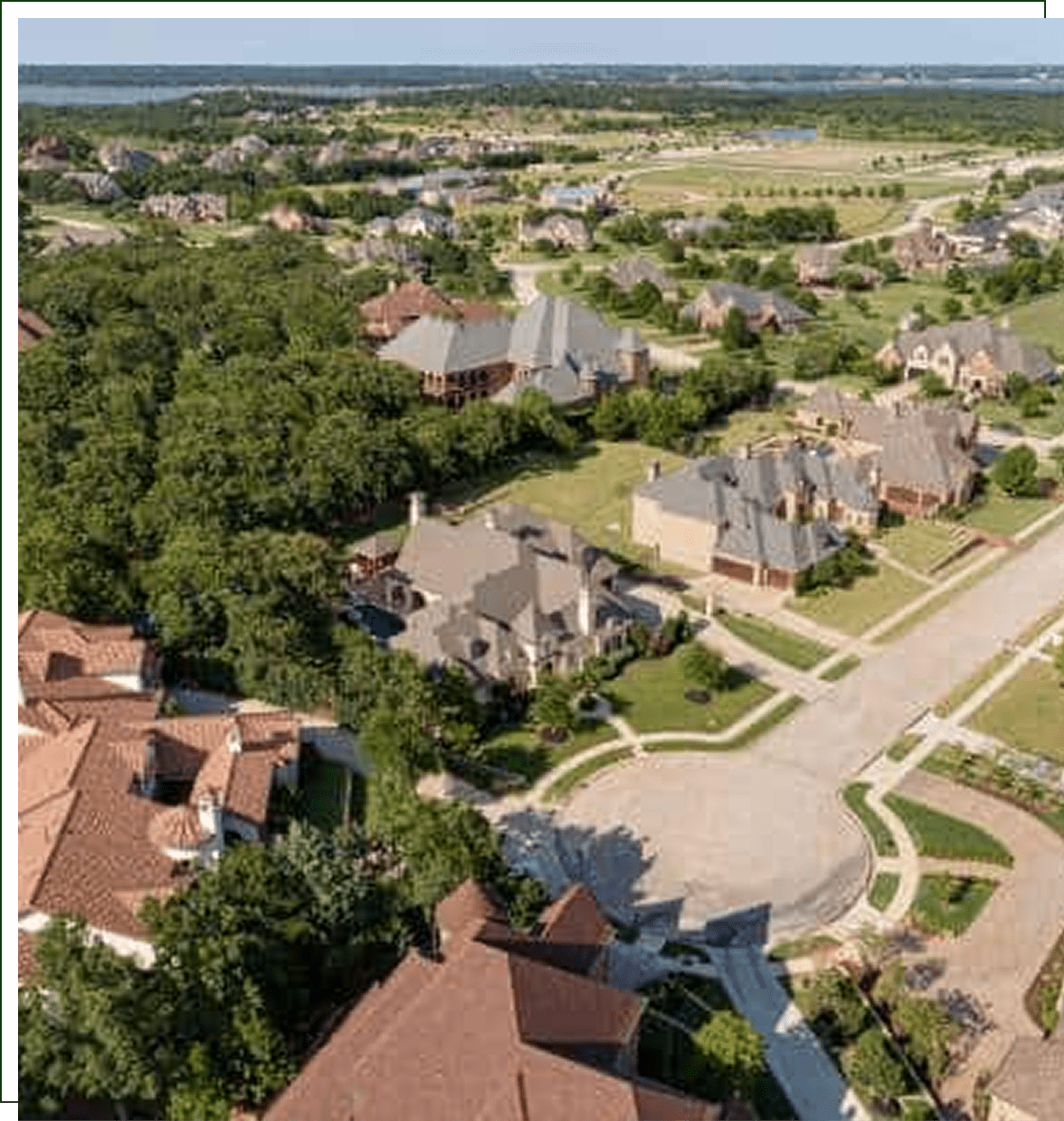 A bird 's eye view of houses and trees.