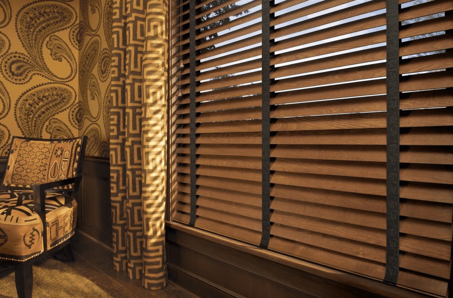 A wooden window with blinds on the outside of it.