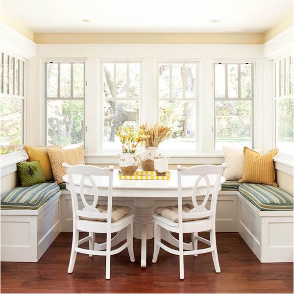 A dining room table with chairs and benches
