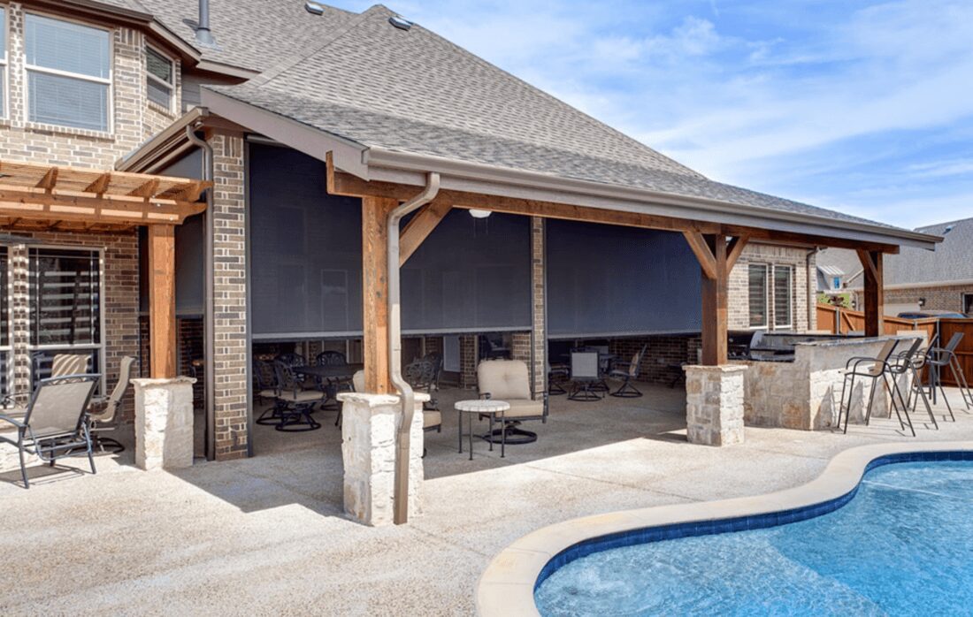 A pool with an outdoor patio and covered area.