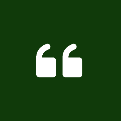 A green background with two white quotation marks.