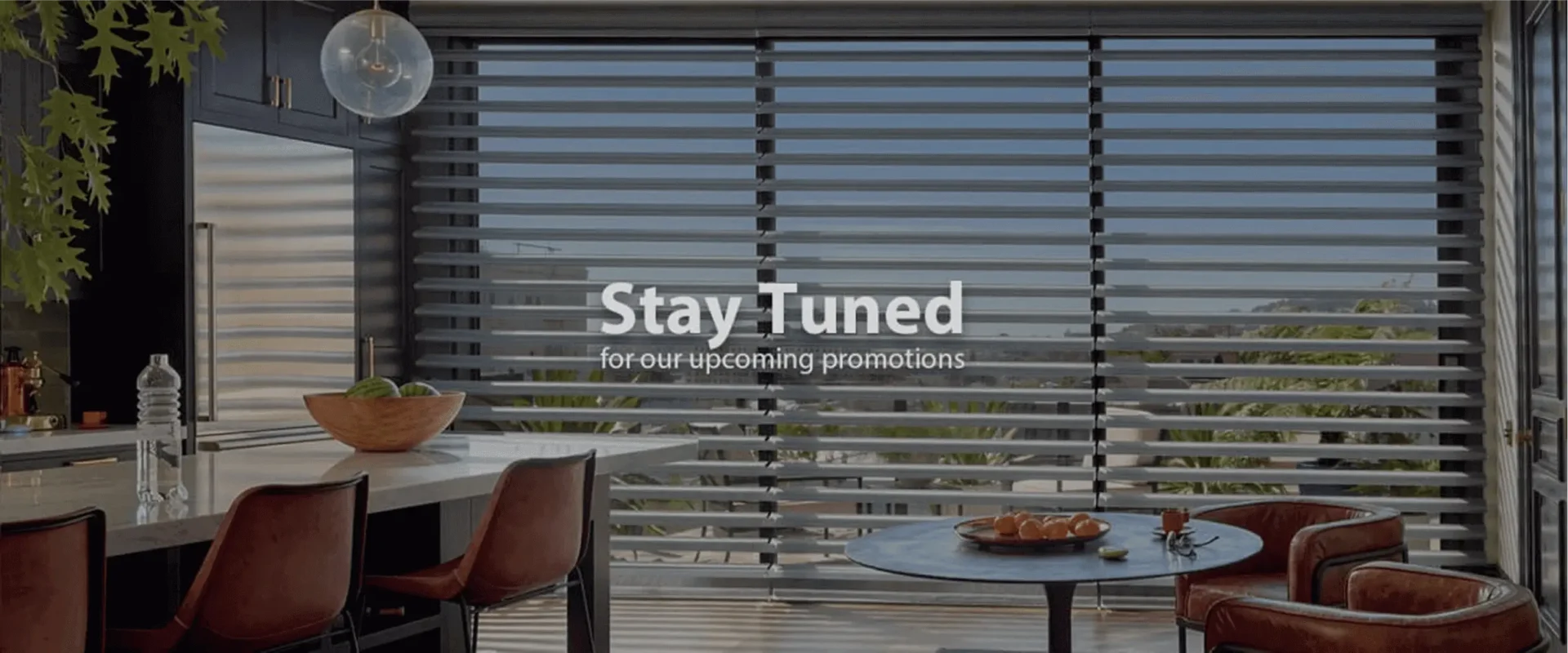 A balcony with a view of the ocean and a bowl of fruit.