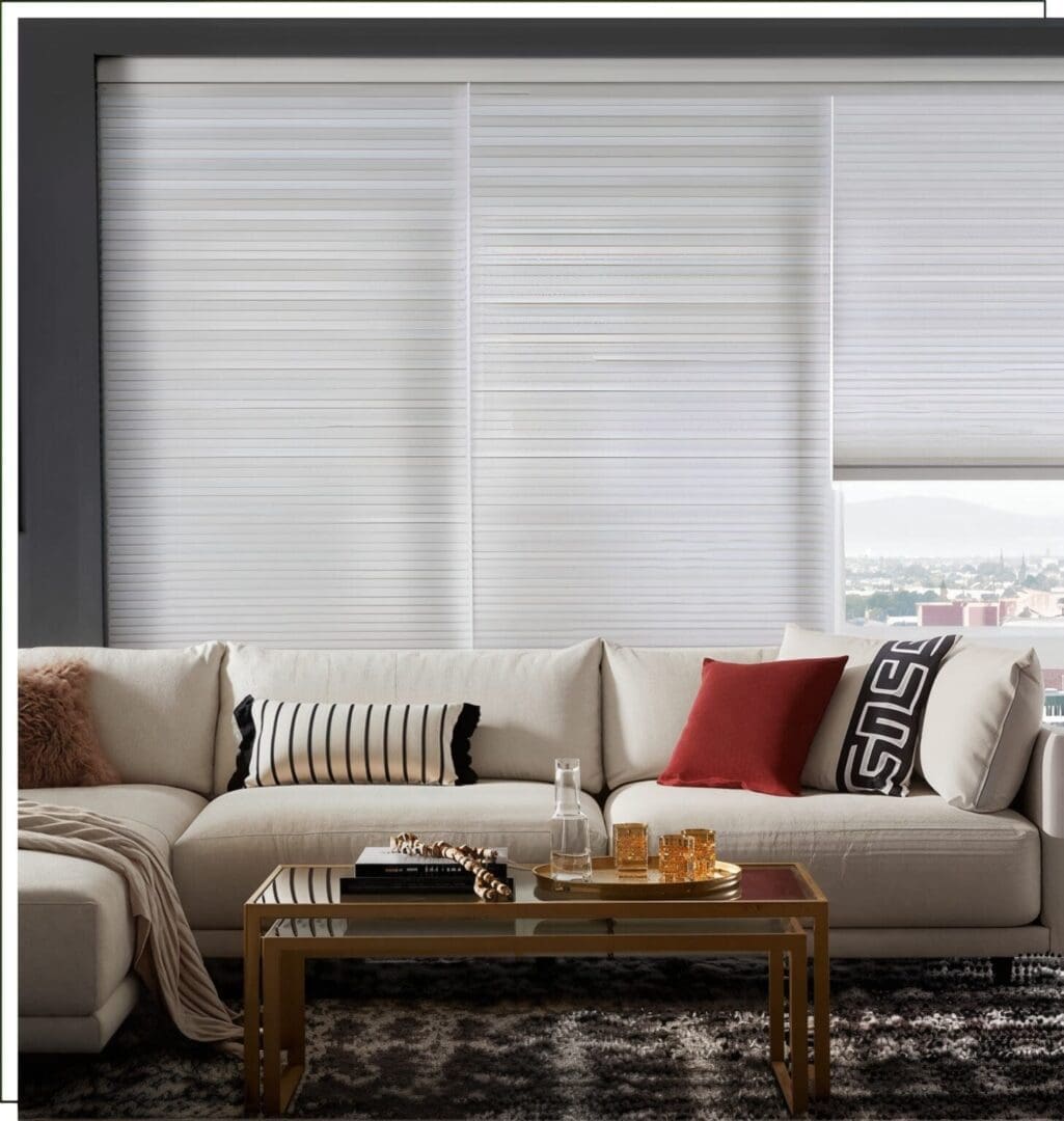 A living room with white furniture and a coffee table.