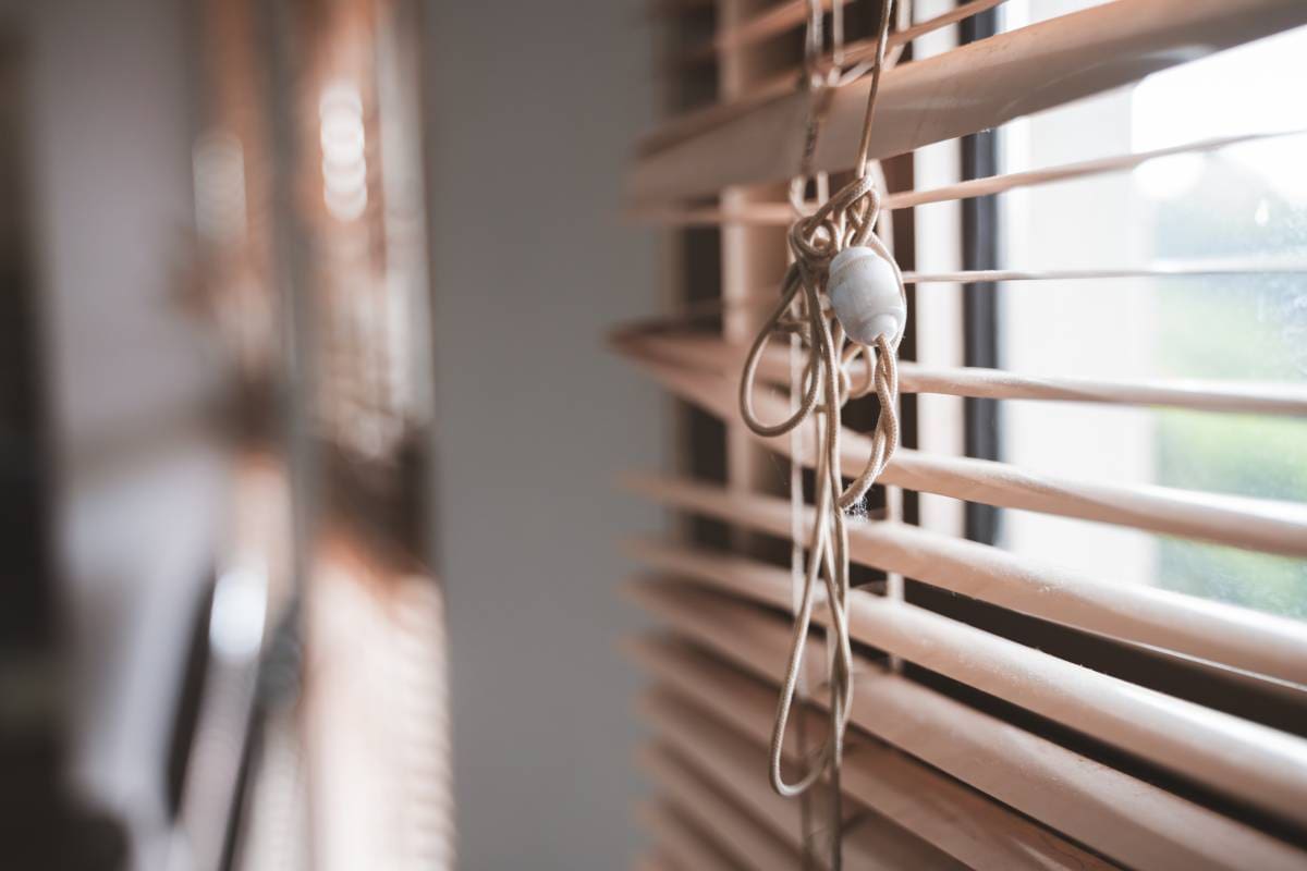 Set of broken blinds covering a window