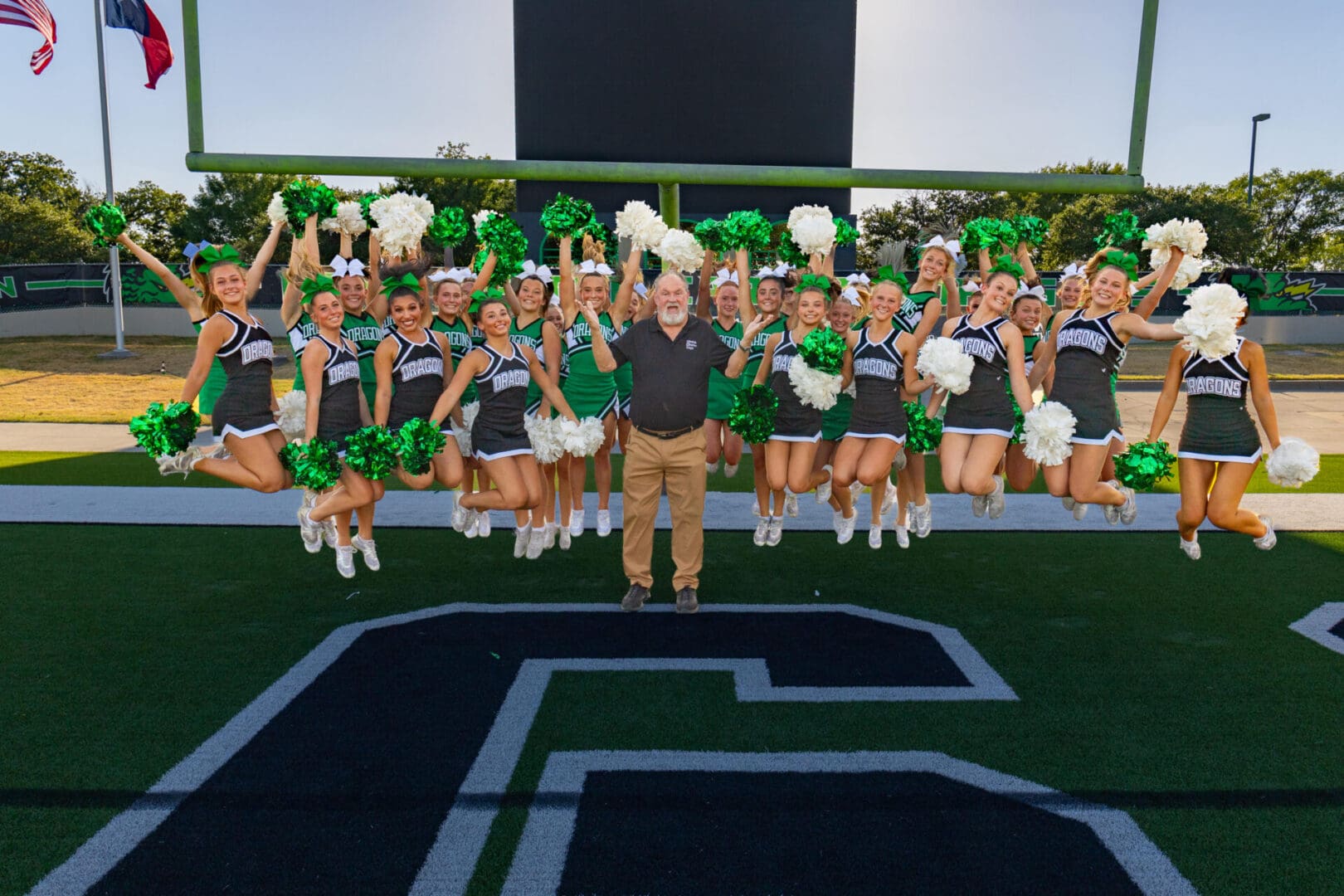 Karl is Jumping for Joy with the Southlake Carrol Dragon Cheerleaders. Photo by WooDoo 

https://www.instagram.com/woodoophoto/